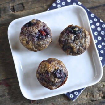 Peach and blueberry muffins for toddler sitting on a plate.