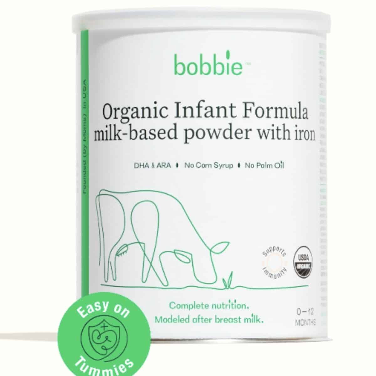 Can of white and green booby formula for baby.