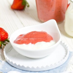 Small white bowl filled with homemade baby food puree and yogurt.