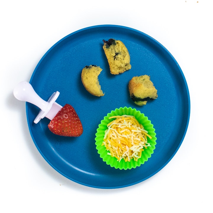 Blue plate filled with healthy snacks for toddler or baby. 