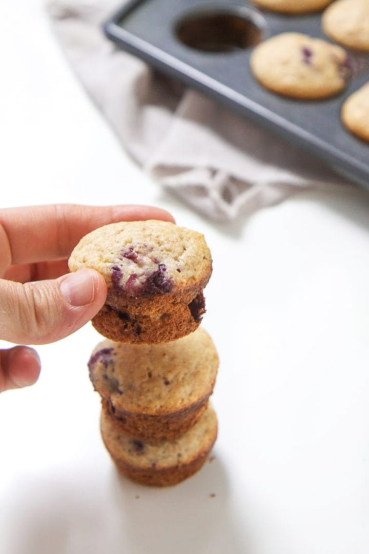 Stack of mini blueberry muffins for toddler and kids.