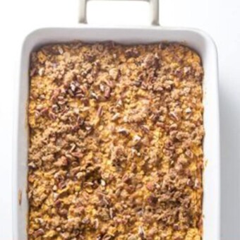 Baked pumpkin oatmeal in a white baking dish.