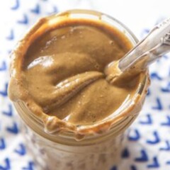 spiced nut butter in a jar with a knife.