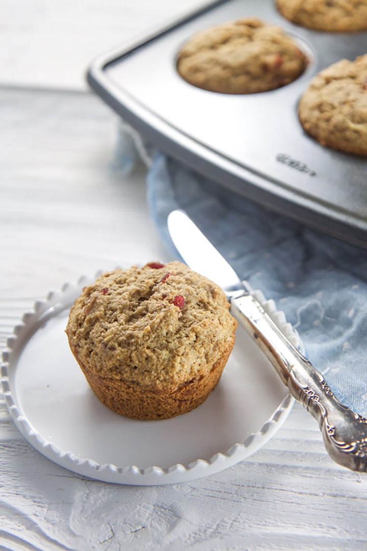 apple muffin with a knife next to it.
