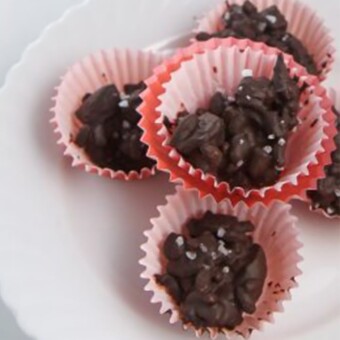 Cherry almond clusters in red cupcake papers.