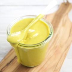 Honey mustard dipping sauce in a glass jar.