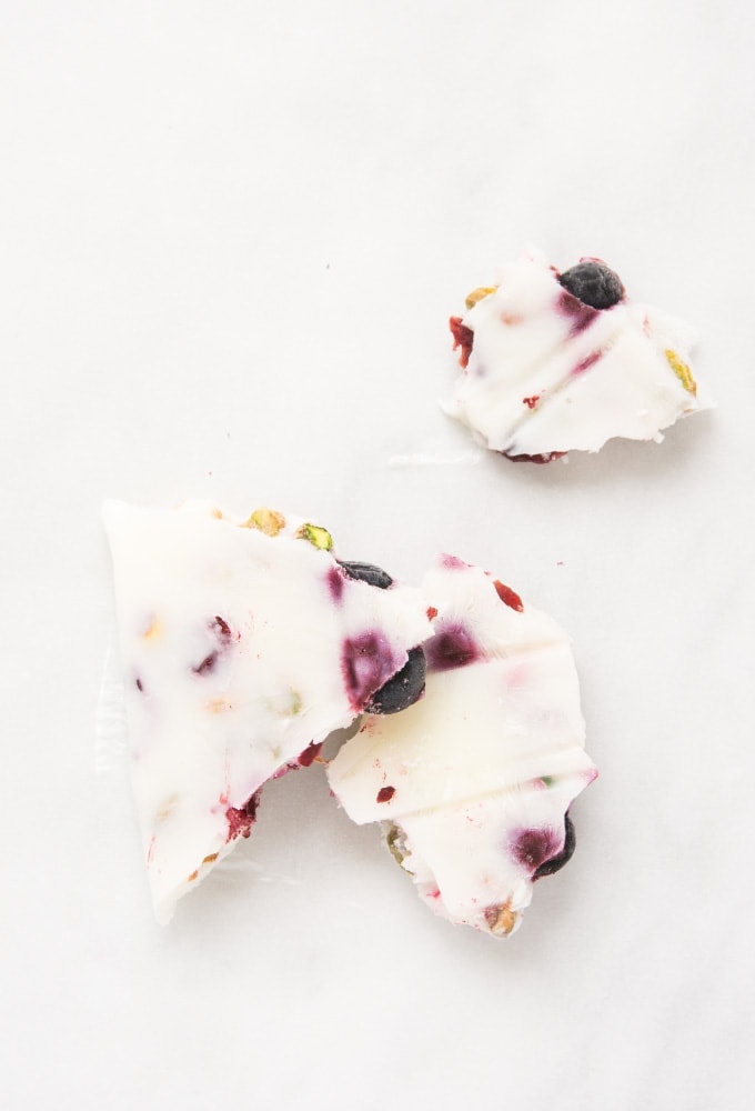 Yogurt bark with blueberries on marble counter