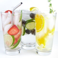 Three glasses of fruit infused water for kids and toddlers.
