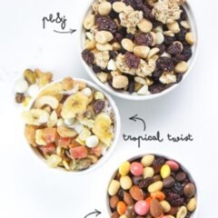 Three trail mixes in white bowls.