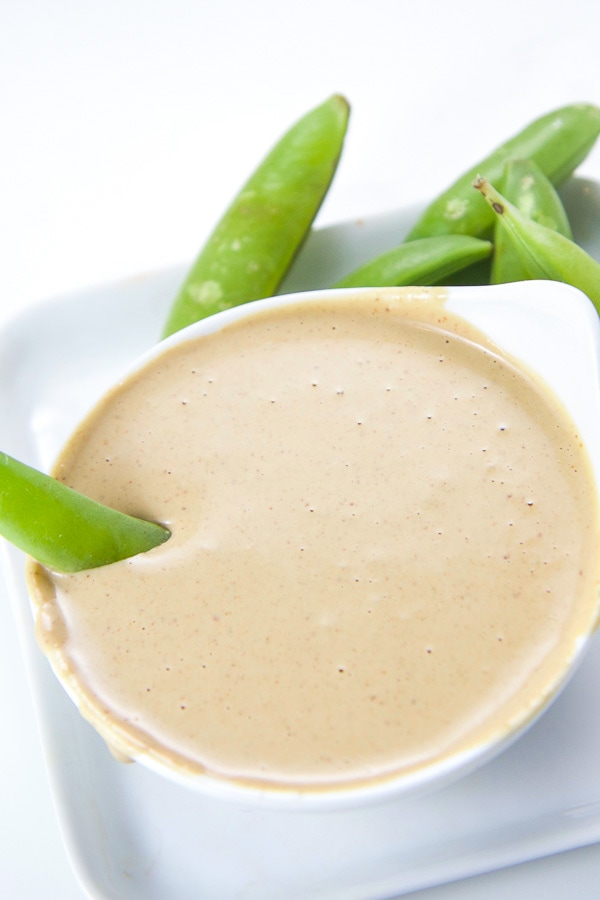 Healthy thai peanut yogurt dip for kids and toddlers in a white bowl.