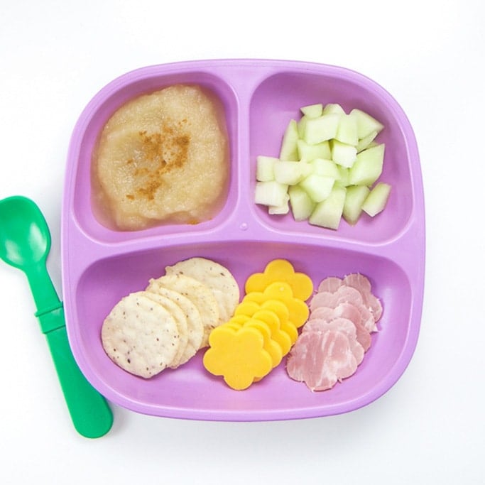 A healthy lunch for a toddler on a purple plate.