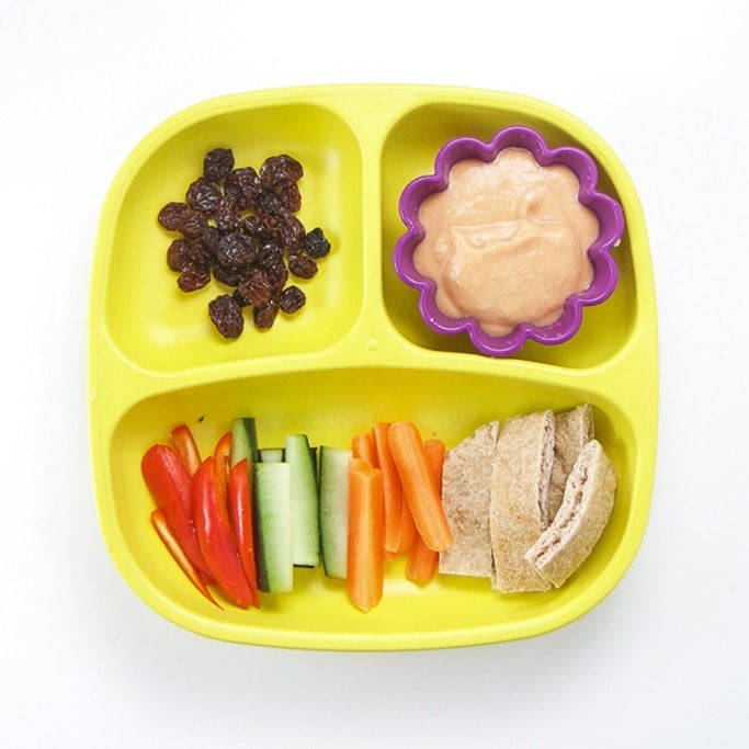 A quick and easy toddler lunch idea on a yellow sectioned plate.
