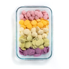 Pick up container full of five different flavors of yogurt melts.