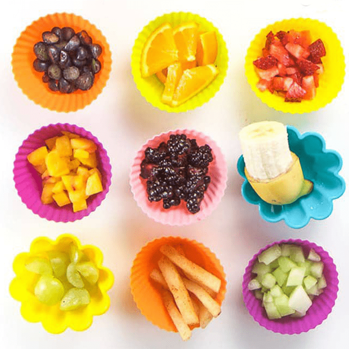 9 colorful cups full of fruits for baby. 