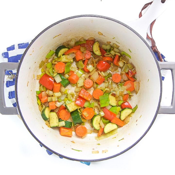 Cooked veggies in a saucepan.