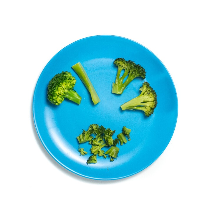 Blue baby plate with 3 different ways how to serve baby broccoli,