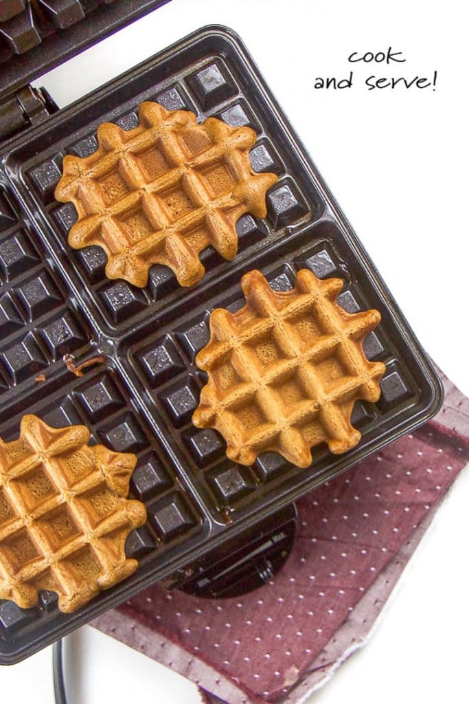 gingerbread waffles cooing on a waffle iron,