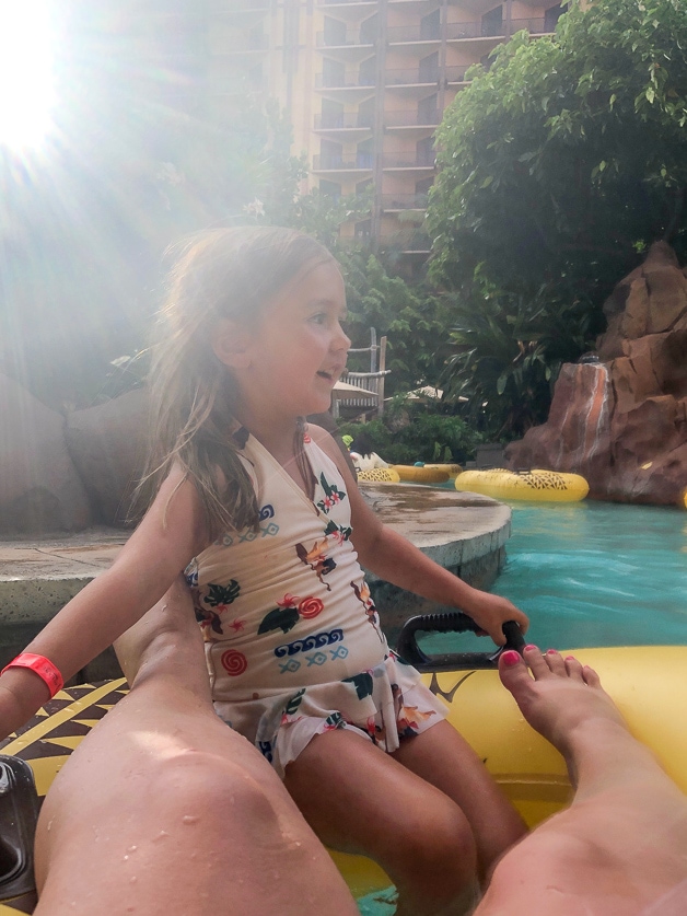 girl on a raft in lazy river at Disney Aulani. 