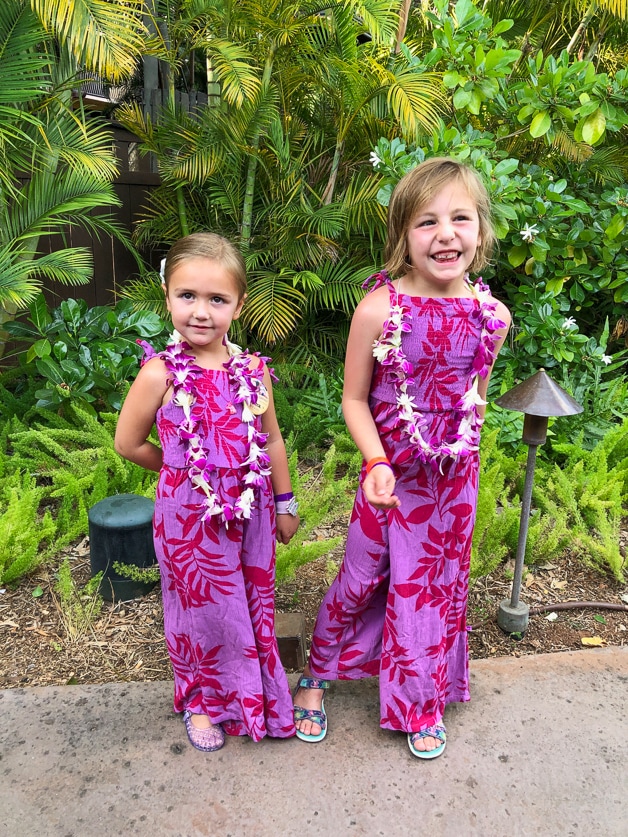 2 girls with leis getting ready for la'ue - best moment at Disney Aulani. 