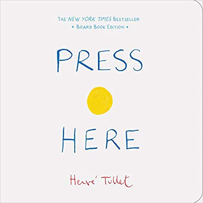 press here book with yellow dot on the cover. 