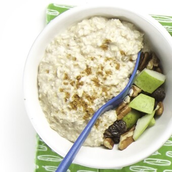 White bowl filled with oatmeal and a surprise.