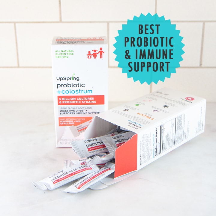 Box of probiotics with tiny packets spilling out of an open box.