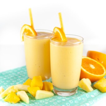 two toddler or kid smoothies with citrus fruit around it for toddler and kids