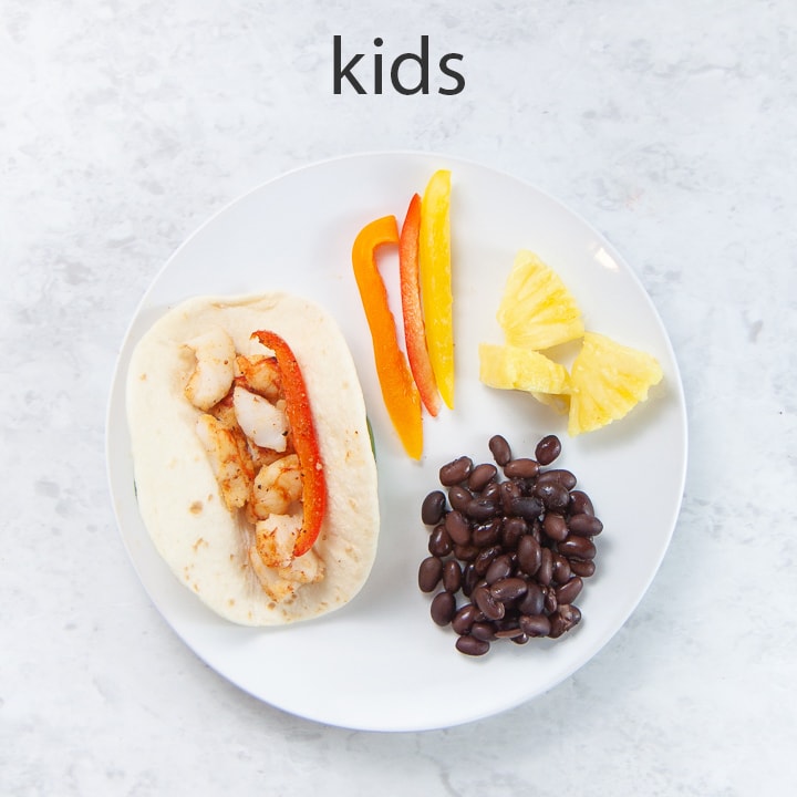 kids plate filled with healthy food.