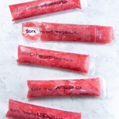 Popsicles scattered on a backdrop.
