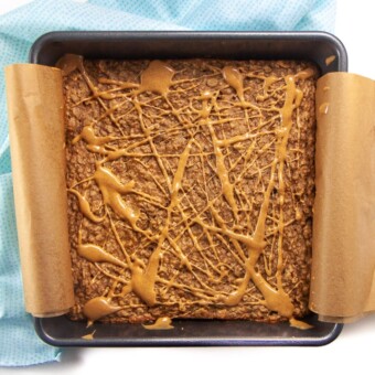 Banana peanut butter oatmeal bake with swirl of peanut butter on top.