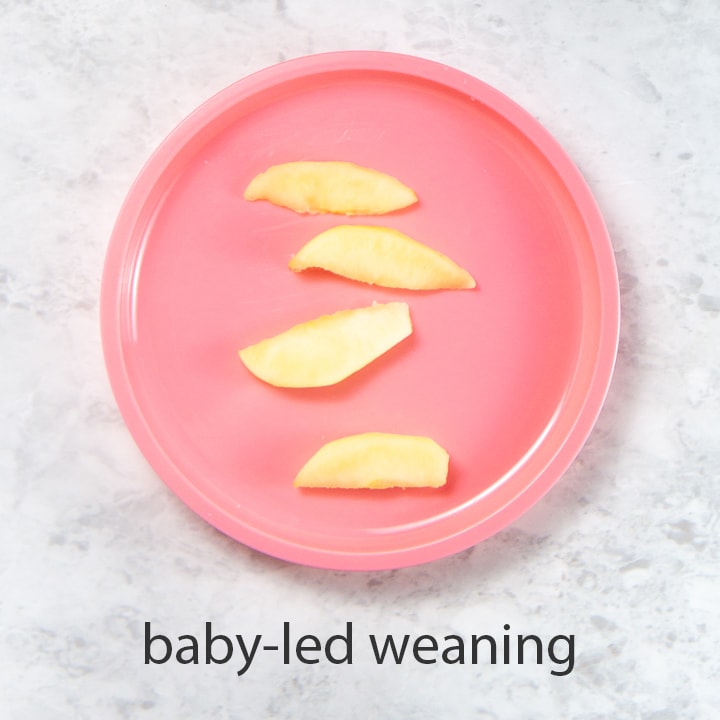 slices of apple on a plate is a great first food for baby.