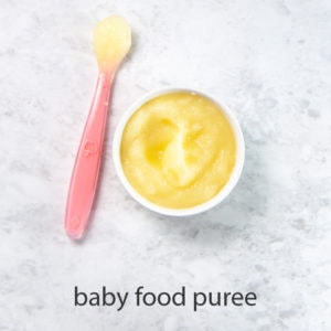 bowl of apple baby food puree - great for one of baby's first foods.