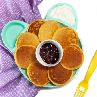 Plate full of baby-led weaning pancakes with dips.