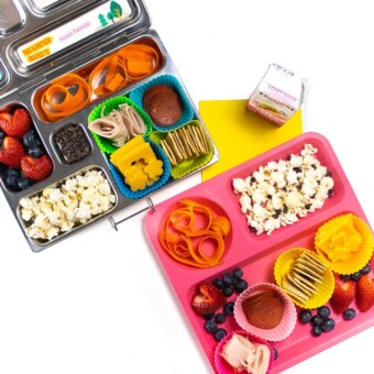 Homemade lunchables for kids in a bento school lunch box as well as a plate for home lunch.