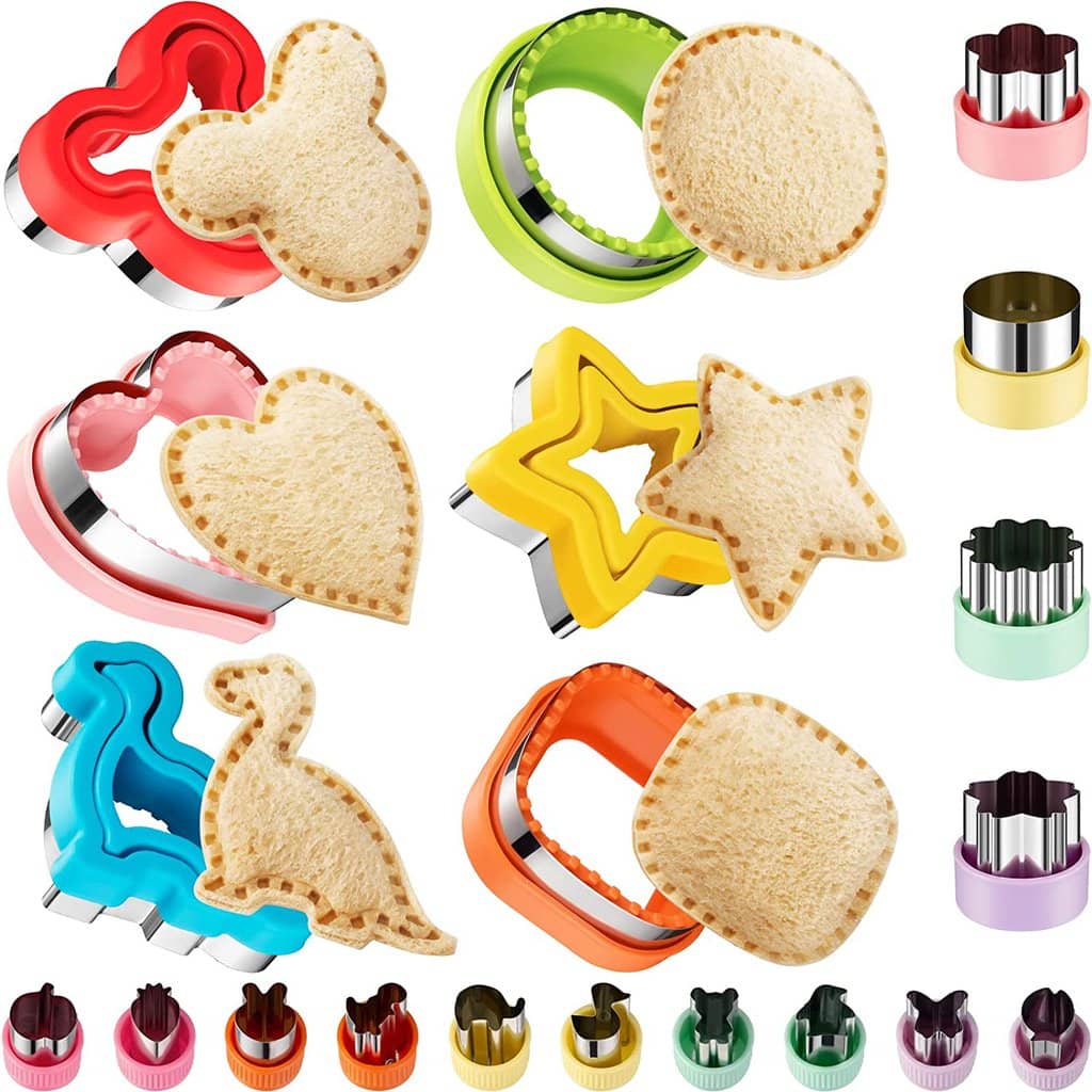 A bunch of colorful sandwich cutters as well as some veggie and fruit cutters. 
