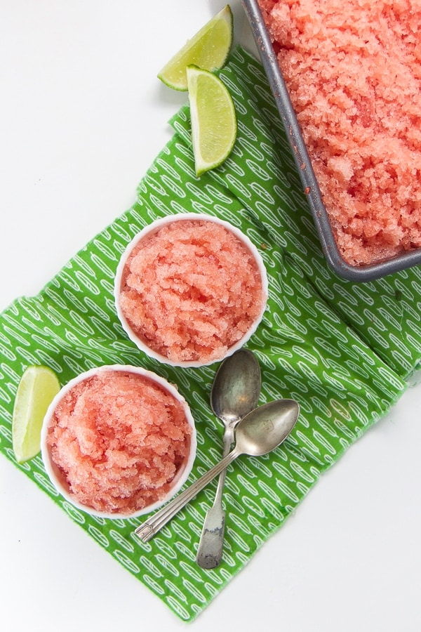 Watermelon slush in dishes on green patterned tablecloth