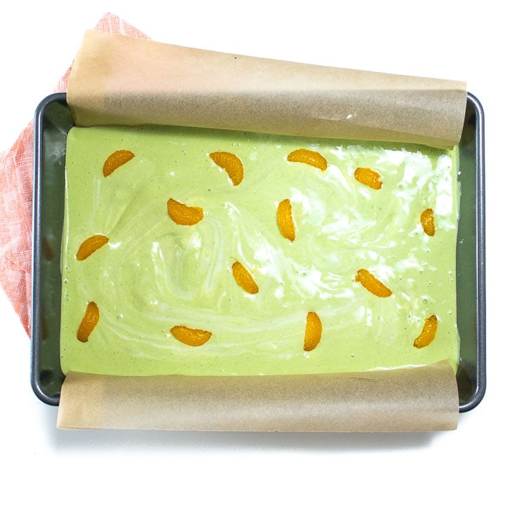 baking sheet full of green yogurt and fruit.