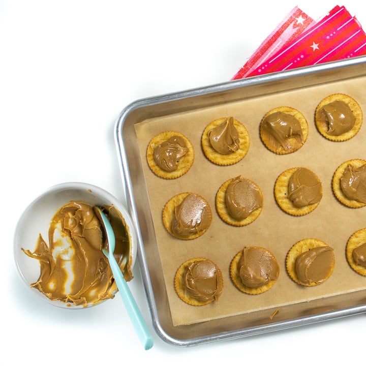 Sheet pan of ritz crackers and peanut butter.
