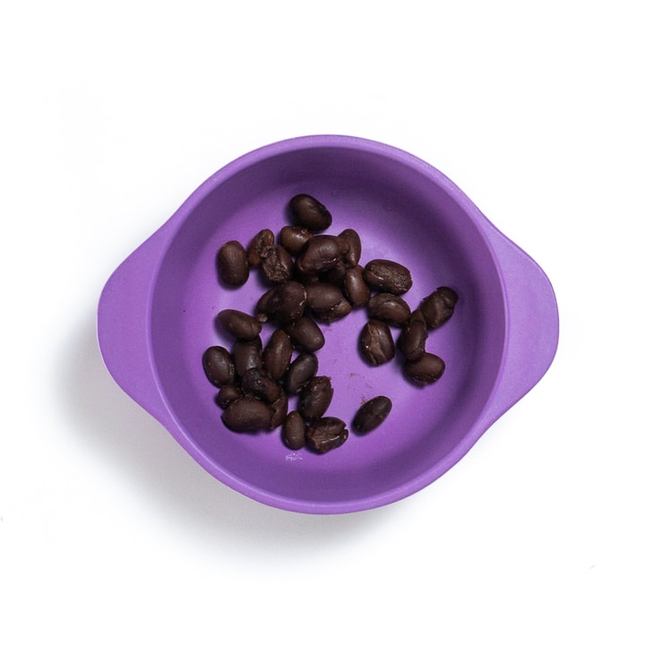 Purple bowl filled with beans.