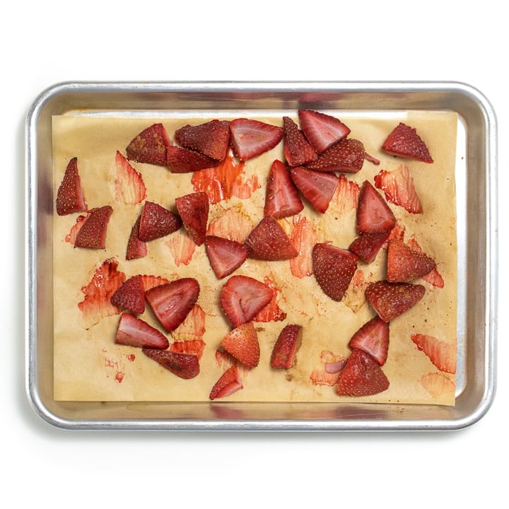 Baking sheet with roasted strawberries.