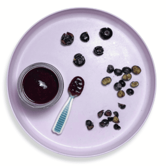 Purple baby plate showing different ways to serve blueberries to baby.