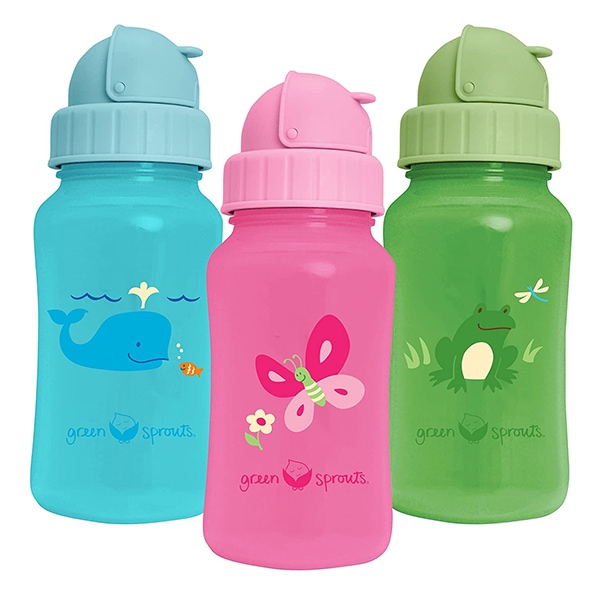 3 bottles, blue, pink and green sitting next to each other.