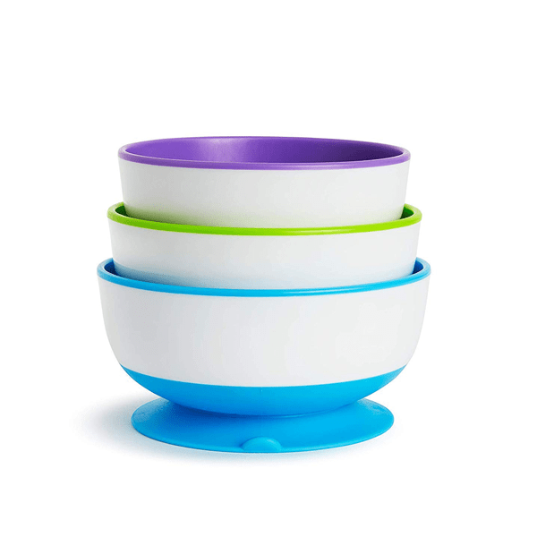 Stack of 3 white bowls with colorful insides.