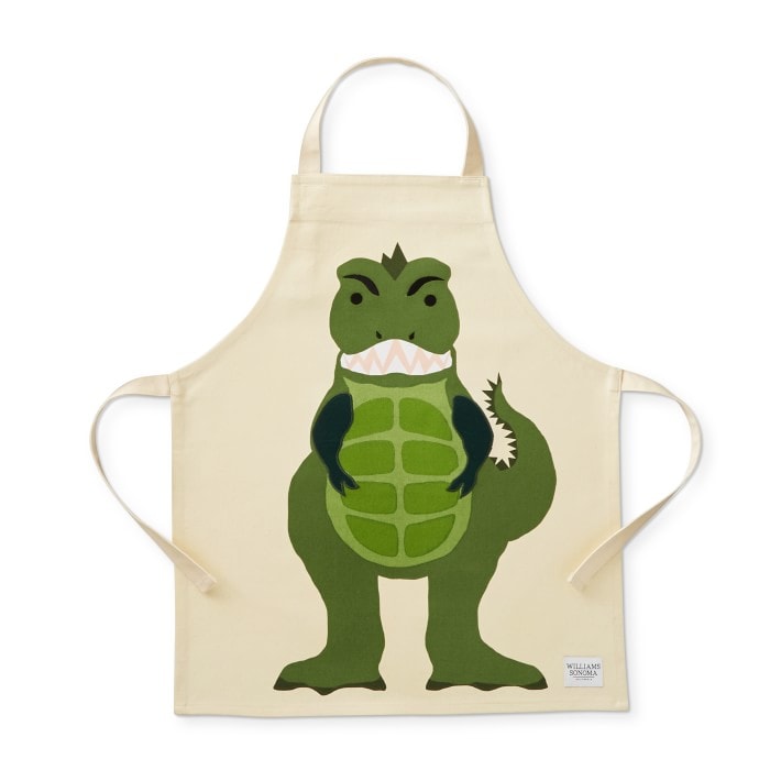 beige apron with a face on t-rex on it. 