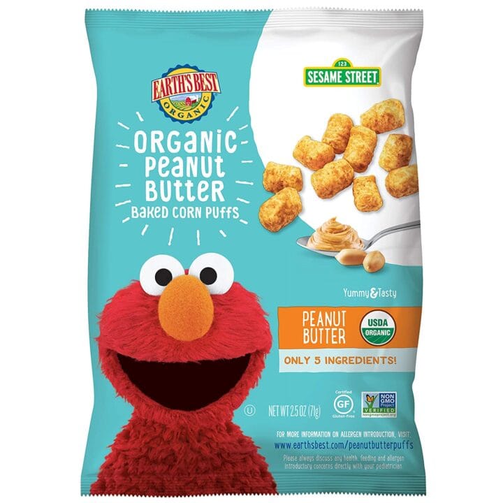 Blue bag of peanut puffs for baby with a muppet on th efront. 