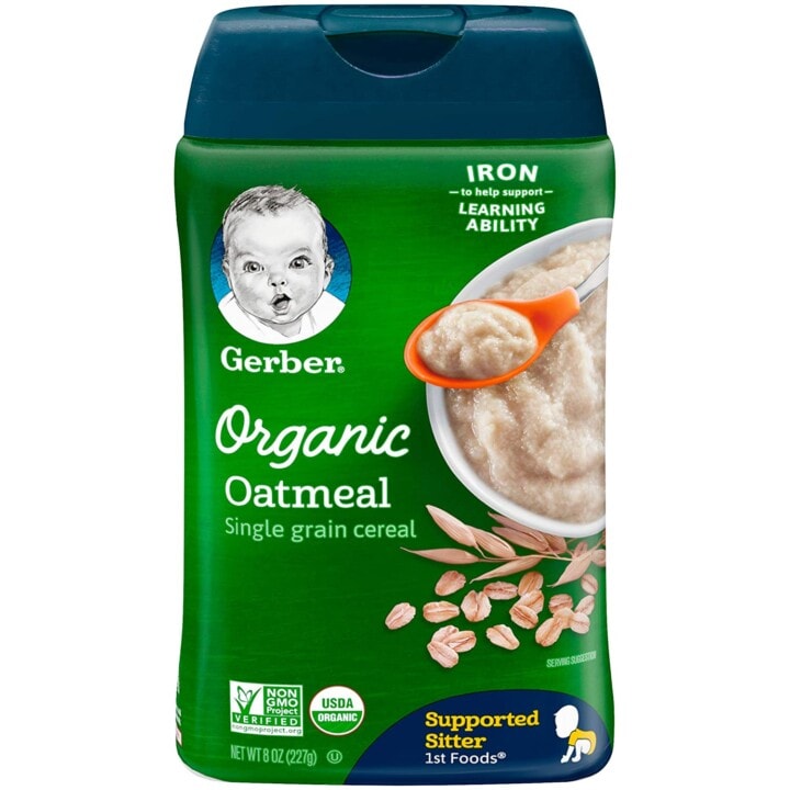 Green jar of oatmeal for baby. 