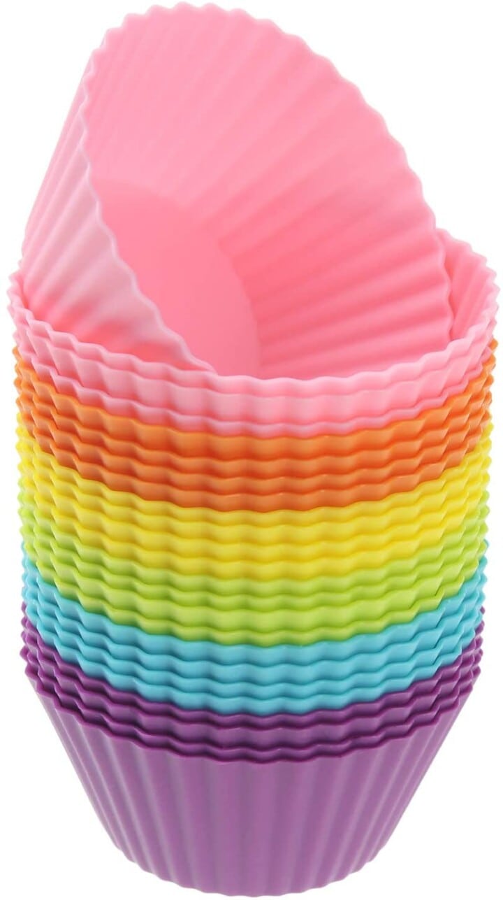 stack of rainbow colored silicone cupcake holders. 