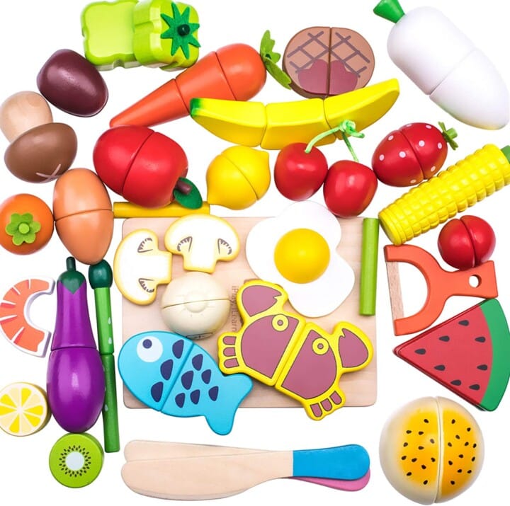 Colorful wooden fruit and veggies that kids can cut in half with a wooden spoon. 