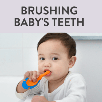 Graphic for post - brushing baby's teeth - guide for infants - 4 years. Image is of a baby against a white background holding an orange and blue toothbrush to his mouth.