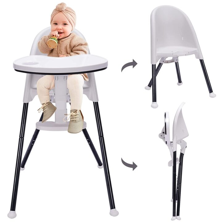 A black and white plastic high chair for baby that can collapse and be stored away for small spaces.
